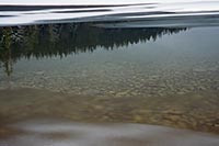 Reflection and ice, Lake McDonald, Glacier N.P, Montana, U.S.